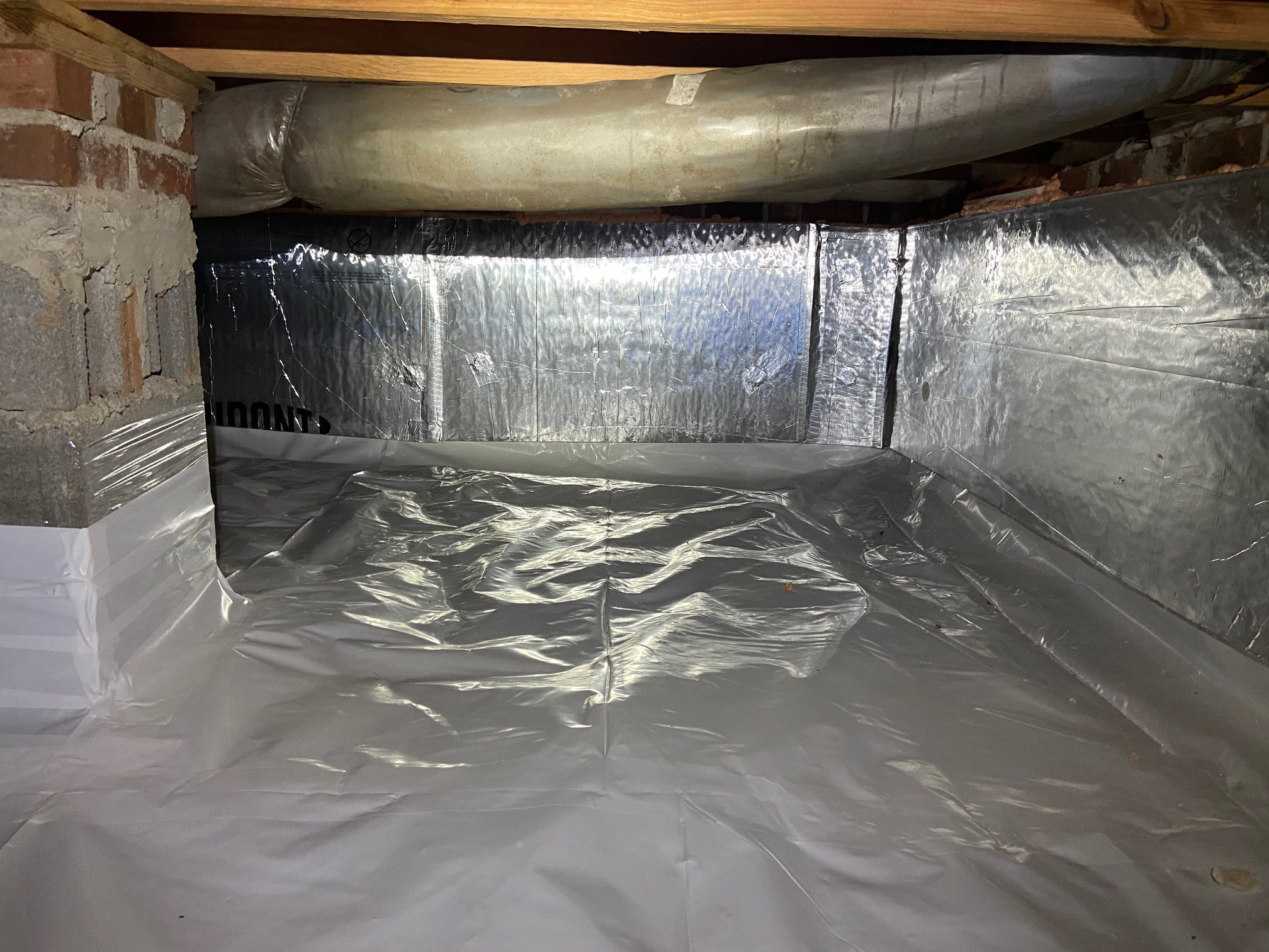 Completed sealed crawl space with professional vapor barrier
